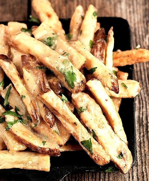 Oven-baked fries with gravy, cheddar, parmesan and fresh herbs